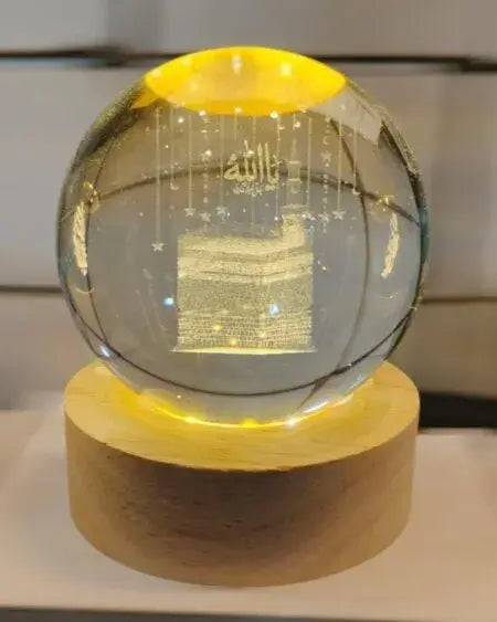 Premium Kaaba Sharif Crystal Ball Lamp glowing on LED wooden base